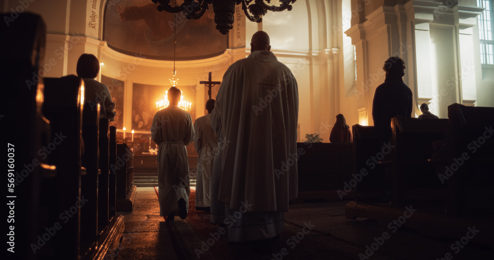 Liturgy in Grand Church: Majestic Procession Of Ministers Walking with Processional Cross to Altar. Congregation Stands In Reverence, Christians Rejoice In Mass Ceremony. Back View