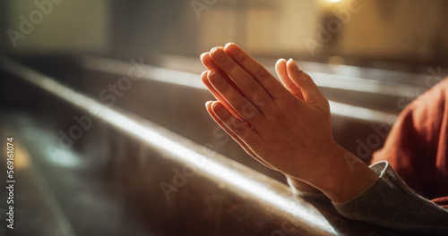 Christian Person Praying with Hands Folded In Reverence. Expression Humility and Faith in God, Seeking Guidance and Strength. Following the Teaching of Lord Jesus Christ, the Bible. Cinematic Concept