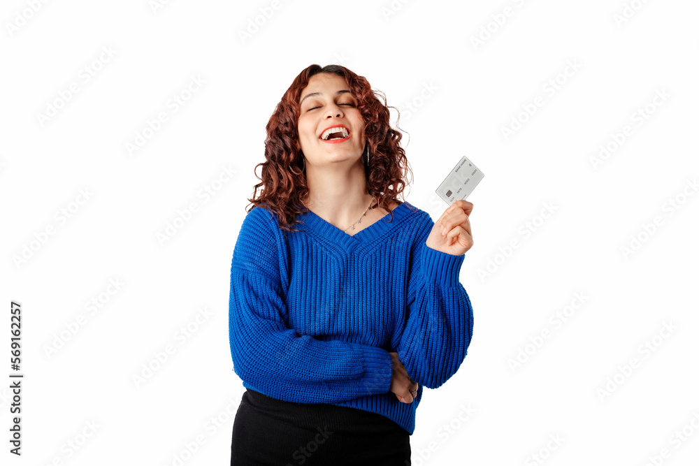Happy woman wearing blue knitted sweater standing isolated over white background laughing and holding credit or bank card. Showing teeth. Happy woman wearing blue knitted sweater standing isolated over white background laughing and holding credit or bank card. Showing teeth.