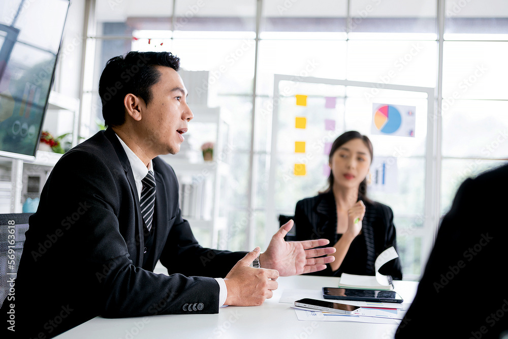 Professional Asian business adviser meeting to analyze and discuss the strategy of financial support of a tech company. Partnership start-up consultant. Professional Asian business adviser meeting to analyze and discuss the strategy of financial support of a tech company. Partnership start-up consultant.