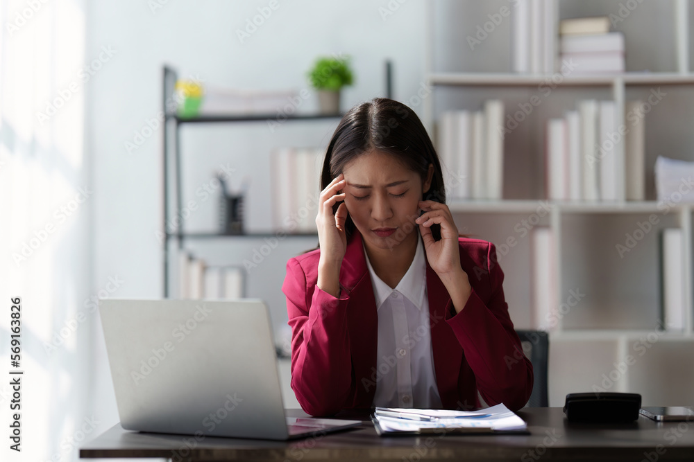 Stressed Business woman checking budget of company, taxes, bank account balance and calculating expenses at office