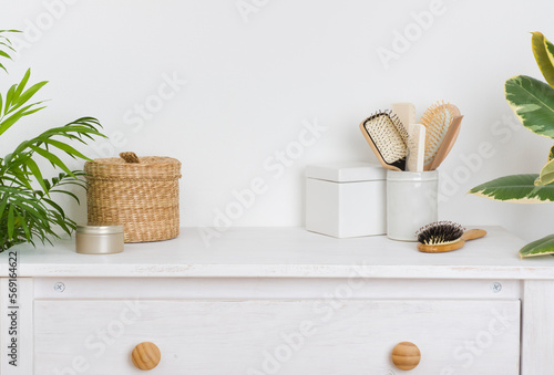 Print op canvas Hair brushing and make up items on wooden dressing table