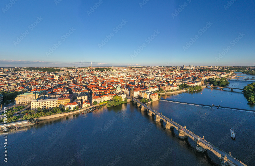 Sunset Prague Old Town in Czech Republic with Famous Sightseeing Places in Background. Charles Bridge Iconic 14th century Structure with View, Vltava river and Prague Cityscape. Must Visit City