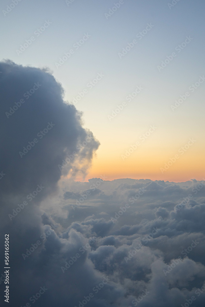 Majestic aerial cloud scape in the sunrise peaceful and religious from the stratosphere with copyspace. Perfect for advertisement or motivational sentences.
