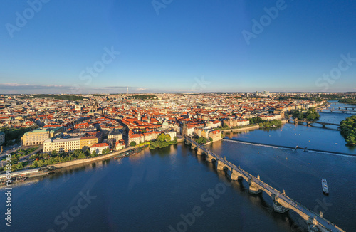Sunset Prague Old Town in Czech Republic with Famous Sightseeing Places in Background. Charles Bridge Iconic 14th century Structure with View, Vltava river and Prague Cityscape. Must Visit City