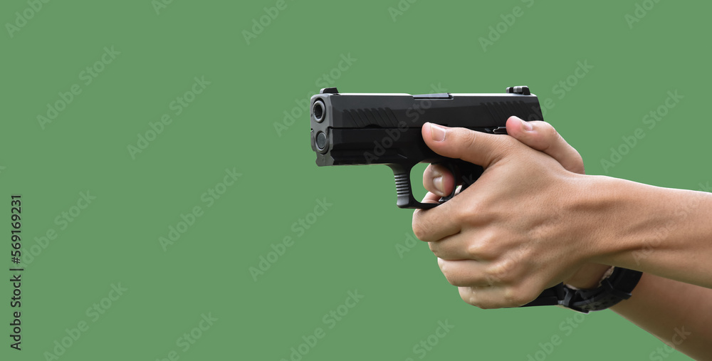 Isolated 9mm pistol gun holding in right hand of gun shooter with clipping paths. Isolated 9mm pistol gun holding in right hand of gun shooter with clipping paths.