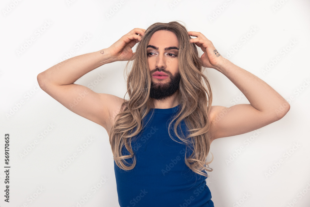 Travesty man fixing his fake long hair Travesty man fixing his fake long hair
