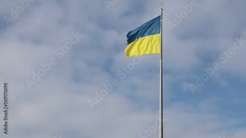Geographical center of Ukraine. Waving flag of Ukraine on a high flagpole.