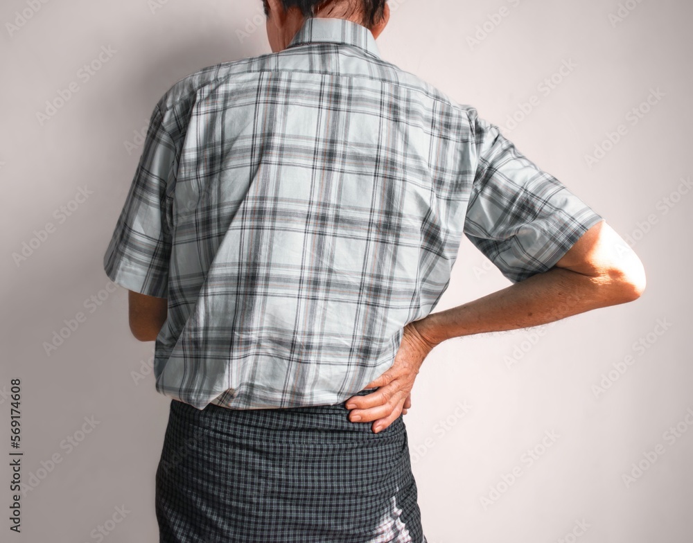 Asian man suffering from right sided low back and loin pain. It can be