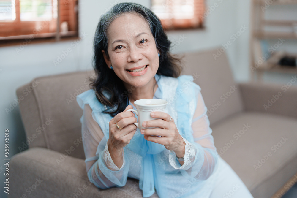 Portrait of an elderly Asian woman drinking tea for health. Portrait of an elderly Asian woman drinking tea for health.