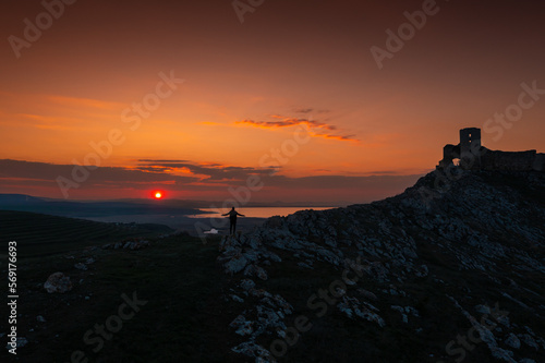 Sunset over Enisala Fortress and village. Aerial view with a beautiful sunset over this landmark place from Dobrogea, Romania.