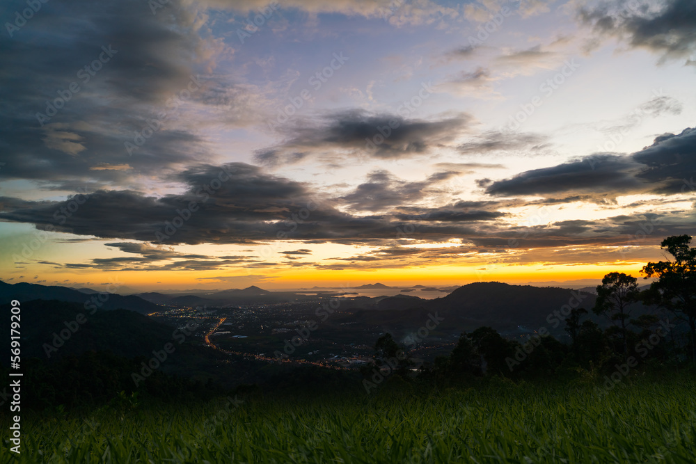 Beautiful skyline landscape sunset sky with mountains and sea.  Cityscape of Ranong Province, Thailand.