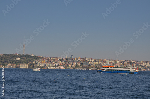 ferryboats on Bosporus strait and Anatolian side of Istanbul city view from Dolmabahce Palace pier