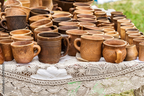 Heap of different clay cups on the table © rashevskiy