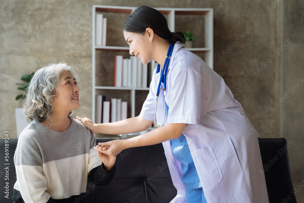 Fototapeta premium Female doctor touching patient's shoulder to encourage treatment.