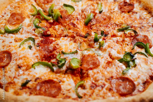 Pizza, food of traditional Italian cuisine. Low angle view, selective focus, close-up