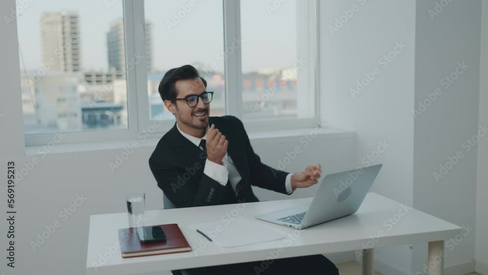 Man business smile and happiness dance winner, successful news, working in office at laptop, workday and paperwork, technology and online. Man business smile and happiness dance winner, successful news, working in office at laptop, workday and paperwork, technology and online.