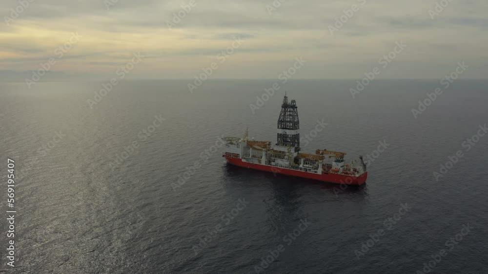 upper view drillship on calm ocean water under vast sky upper view drillship on calm ocean water under vast sky
