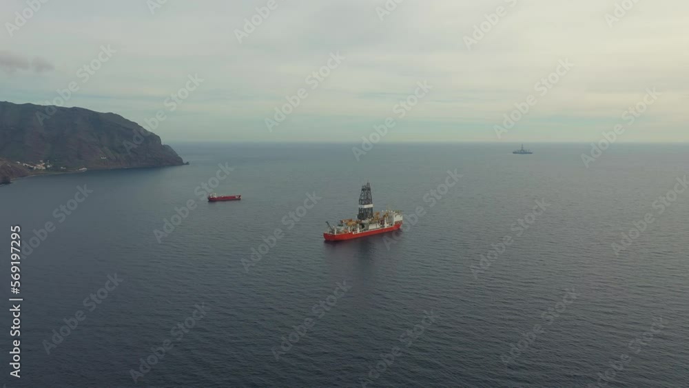 bird eye view drillship with tower and crane on quiet ocean bird eye view drillship with tower and crane on quiet ocean
