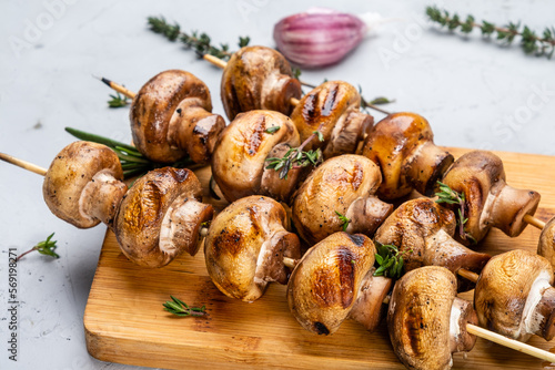 Fried bbq mushrooms on skewers, close-up, bbq mushrooms