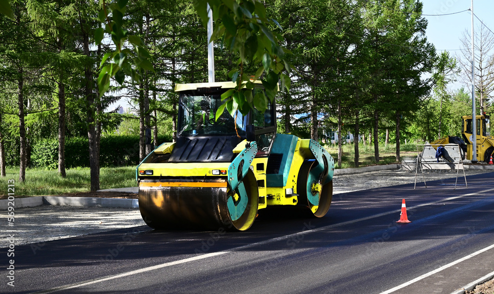Naklejka premium Large view on the road rollers working on the new road construction site