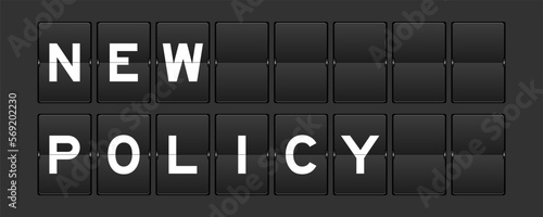 Black color analog flip board with word new policy on gray background