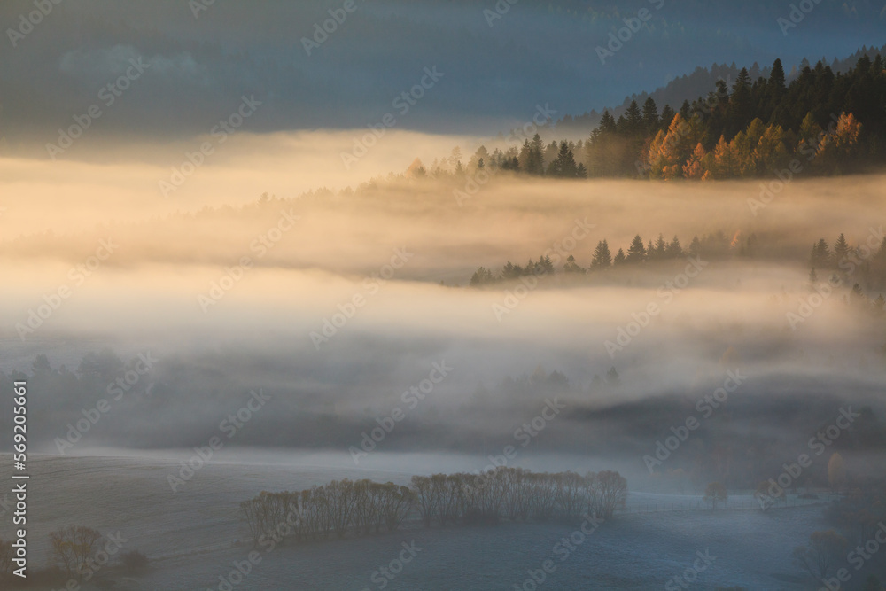 autumn mists floating over the valley