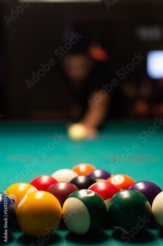 guy playing pool ready to hit with the cue