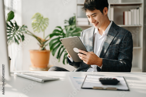 Mature business man executive manager looking at laptop watching online webinar training or having virtual meeting video conference doing market research working in office.