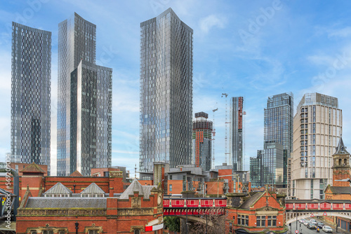 Fotografering The old and new skyline in Deansgate Manchester