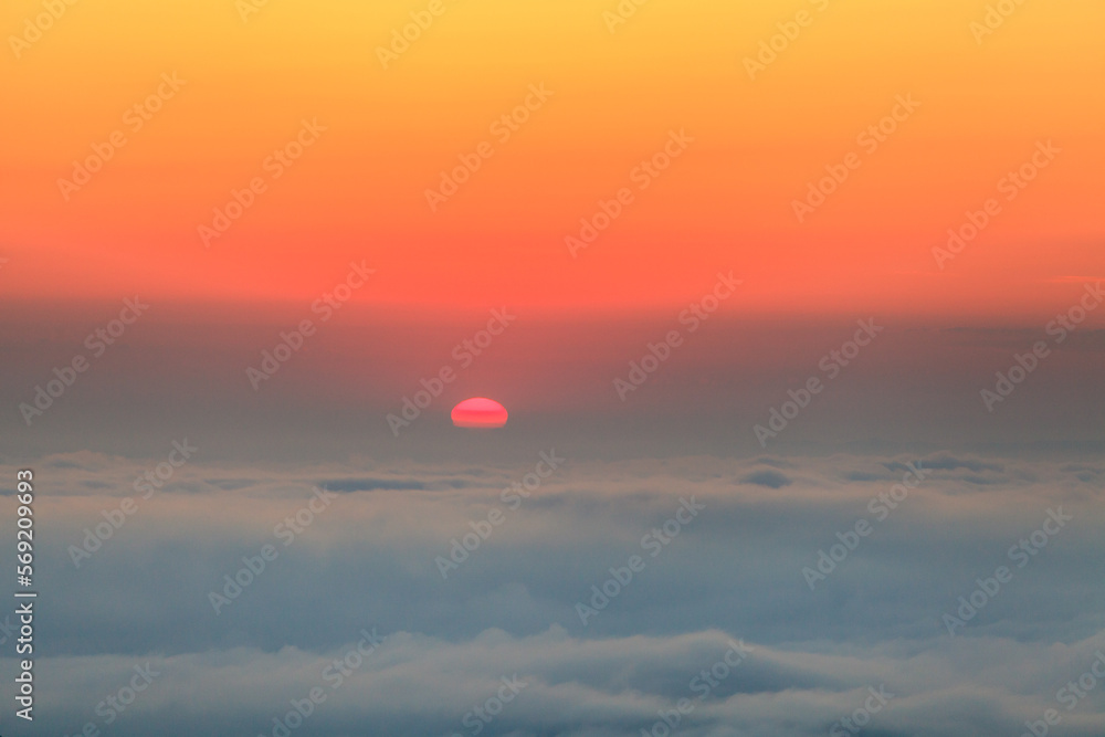red disk of the sun at sunrise
