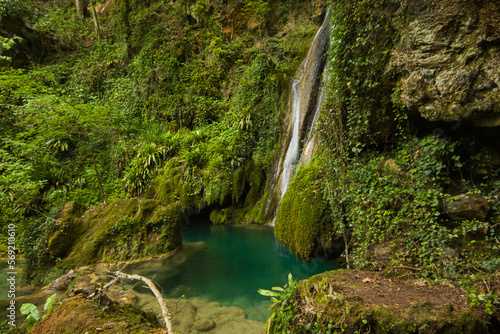 View of secret waterfall in the green forest of Castel di Fiori, Umbria