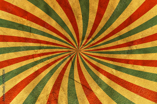 Vintage paper background with rays or stripes in the center. Solar multi-colored rays with spots. Circus poster.