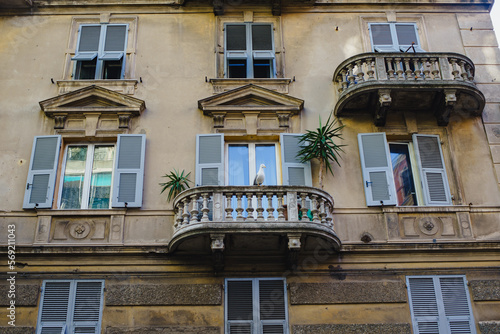 Facade of a medieval villa, Piazza in Italy with balconies and windows. Renaissance Era