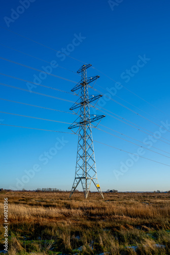 Winter landscape power pylon in the Netherlands 