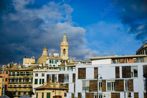 Landscape with colored facades of houses in Europe. Panorama of the city of Genia in Italy. View of the old town. Houses on the hill.
