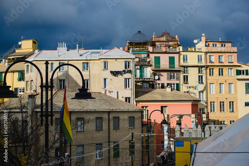 Landscape with colored facades of houses in Europe. Panorama of the city of Genia in Italy. View of the old town. Houses on the hill.
