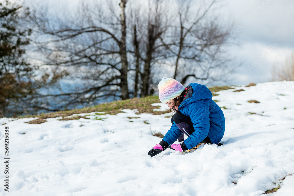 Cheerful girl playing with snow Cheerful girl playing with snow