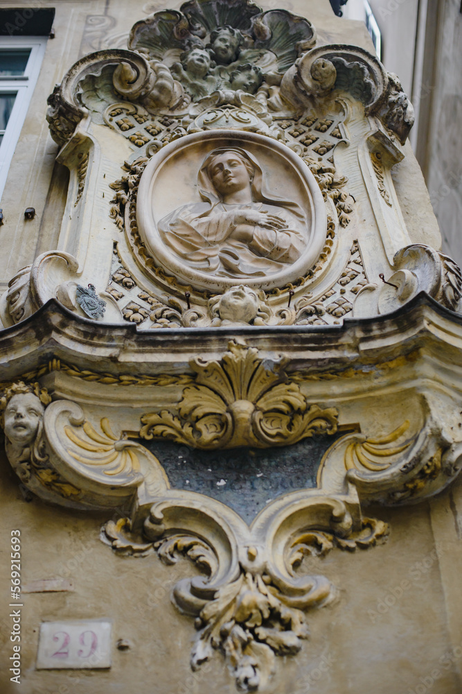 Religious relief on the wall of a historical building in Italy, Europe. Madonna and Child