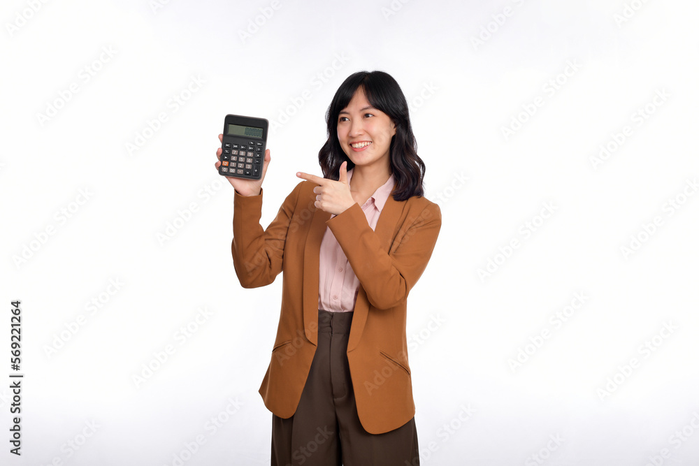 Tax day concept. Asian woman confident smiling holding calculator and finger point device, Portrait happy Asian female isolated on white background, Account and finance counting income Tax day concept. Asian woman confident smiling holding calculator and finger point device, Portrait happy Asian female isolated on white background, Account and finance counting income