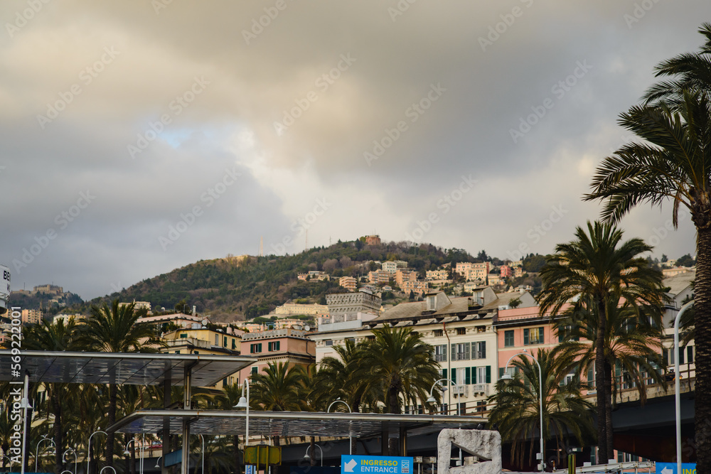 Landscape with colored facades of houses in Europe. Panorama of the city of Genia in Italy. View of the old town. Houses on the hill.