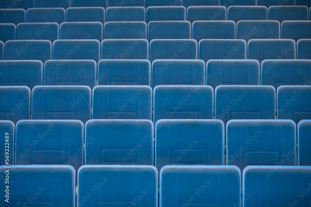 Fototapeta premium A row of empty chairs in the auditorium of the cinema.