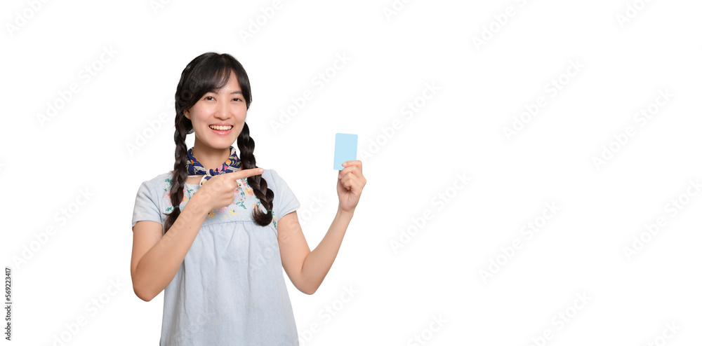 Portrait of beautiful happy young asian woman in denim dress holding credit card on white background Portrait of beautiful happy young asian woman in denim dress holding credit card on white background