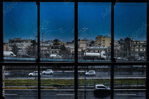 view of snow falling on a busy road