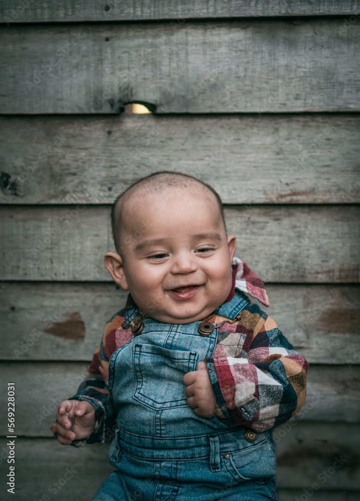 Fototapeta premium Beautiful portrait of a 4 month old baby laughing