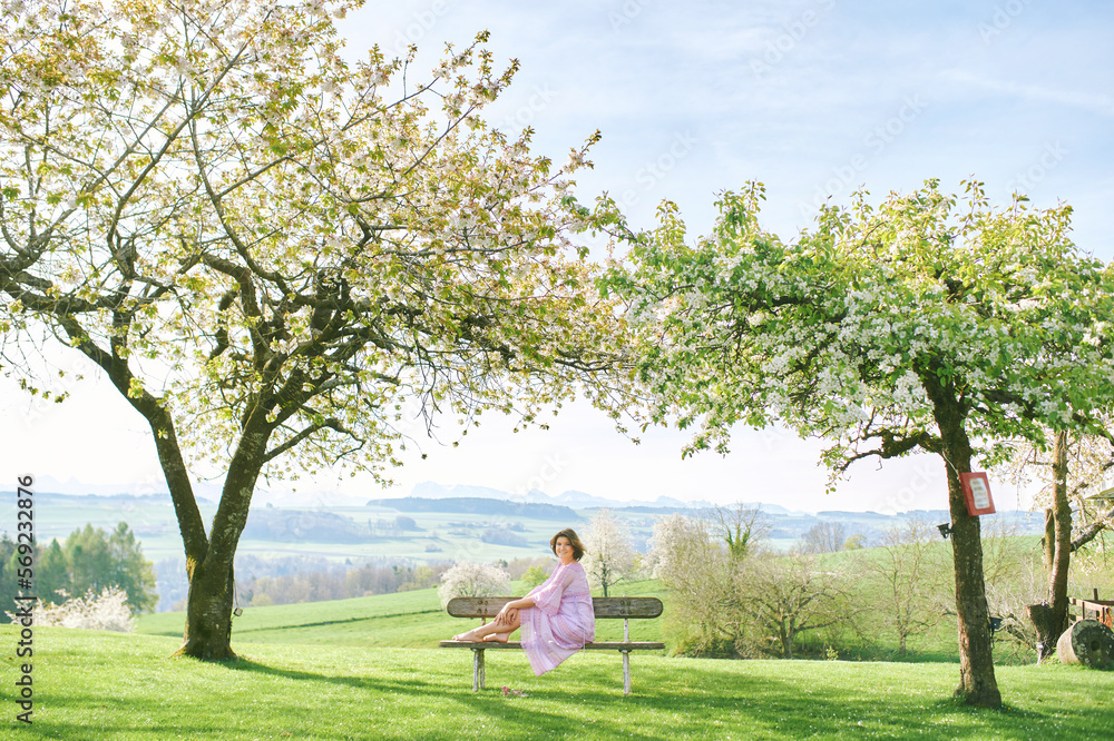 Outdoor portrait of happy pregnant woman enjoying nice sunny day in spring garden Outdoor portrait of happy pregnant woman enjoying nice sunny day in spring garden