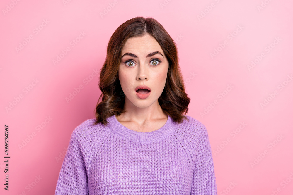 Photo of excited speechless cute woman with wavy hairstyle dressed knit sweater staring open mouth isolated on pink color background Photo of excited speechless cute woman with wavy hairstyle dressed knit sweater staring open mouth isolated on pink color background