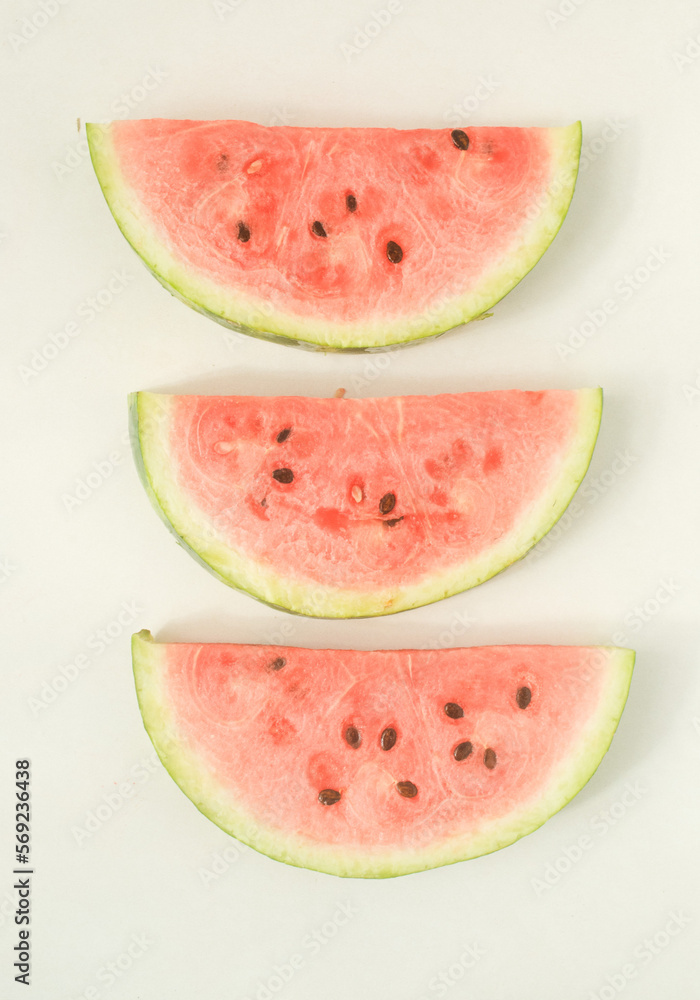 Three slices of watermelon in a white background 