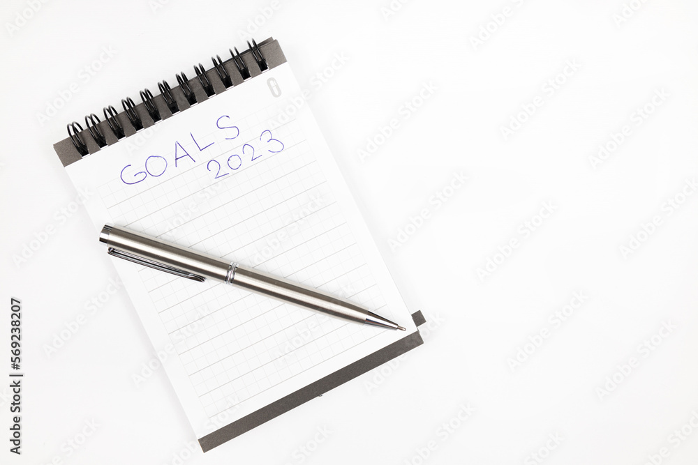 Goals 2023 plan notes with metal pen - Productivity plan - Business and self improvement Goals 2023 plan notes with metal pen - Productivity plan - Business and self improvement