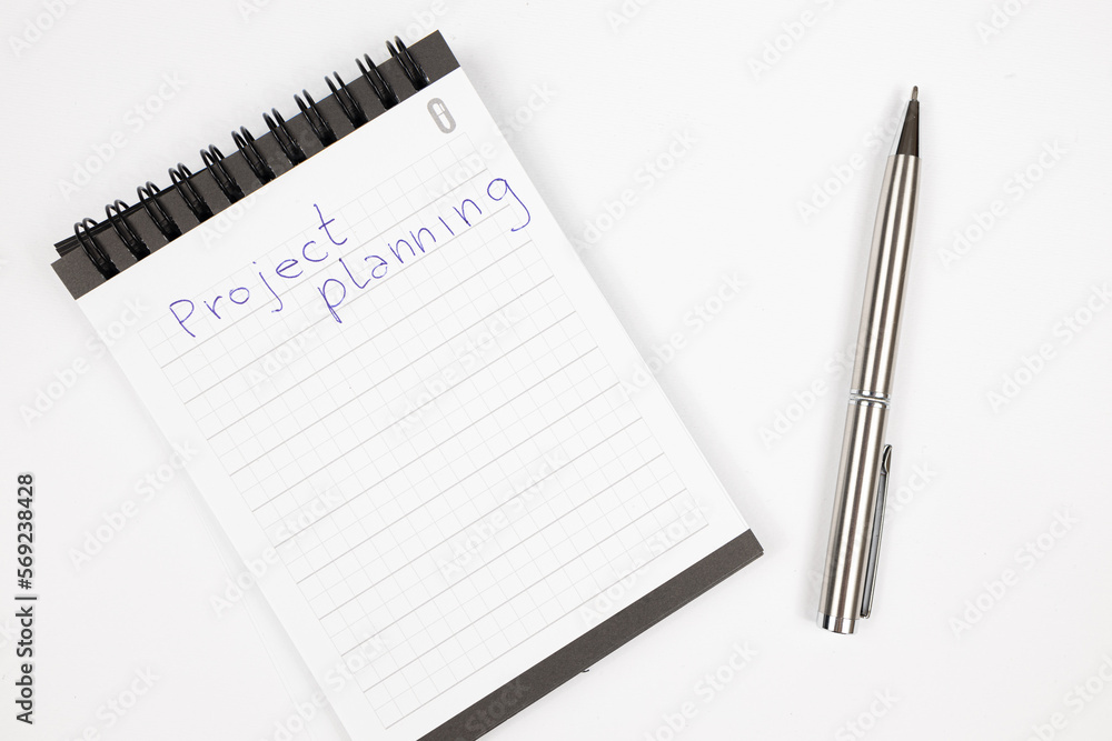 Project plan notes with metal pen - Productivity plan - Business and self improvement Project plan notes with metal pen - Productivity plan - Business and self improvement